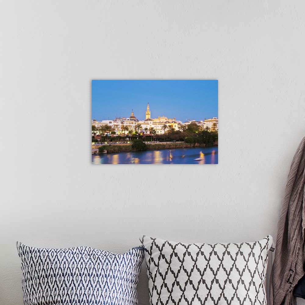 A bohemian room featuring Spain, Andalusia, Seville, View of Guadalquivir river and downtown