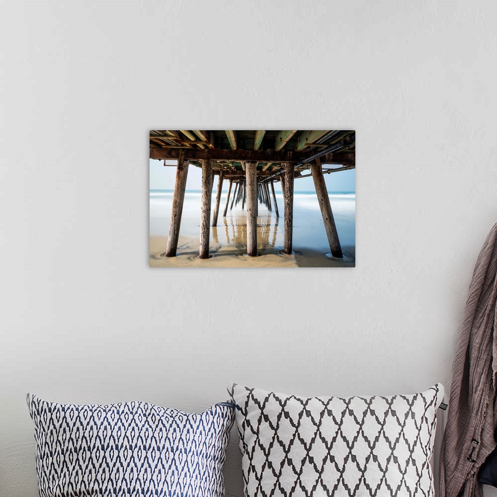 A bohemian room featuring Photograph looking under the Imperial Beach pier, California.