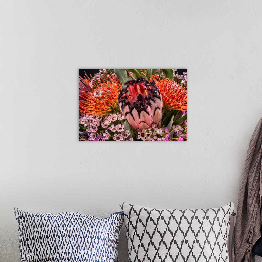 A bohemian room featuring Close-up of photograph of a bouquet of tropical flowers.
