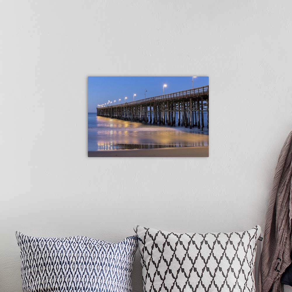 A bohemian room featuring Photograph of Ventura pier lit up at night.