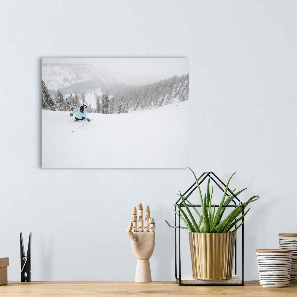 A bohemian room featuring A downhill skier with view of mountains in background