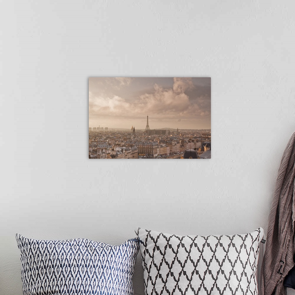 A bohemian room featuring A heavy storm passes over the city of Paris.