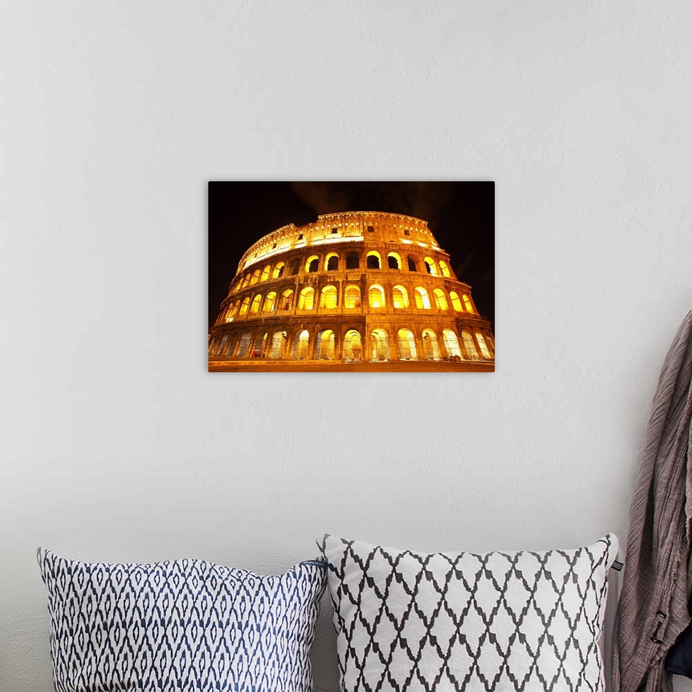 A bohemian room featuring A lit Colosseum in Rome, Italy