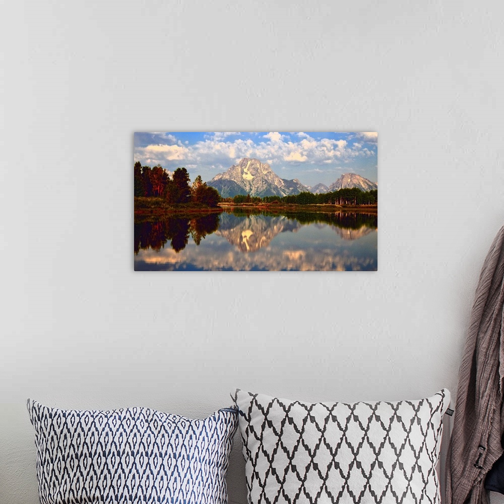 A bohemian room featuring Mount Moran reflected in the still water of the Snake River in Grand Teton National Park during t...