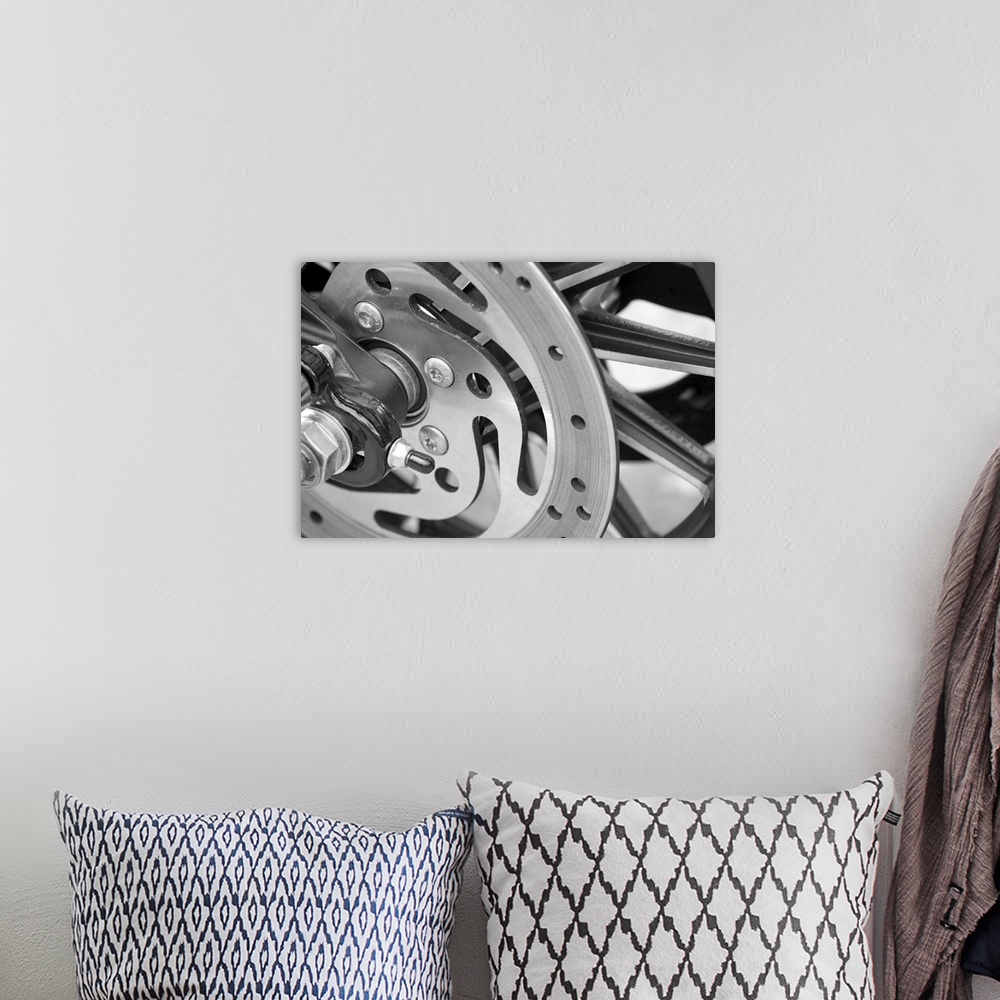 A bohemian room featuring Black and White abstract motorcycle wheel