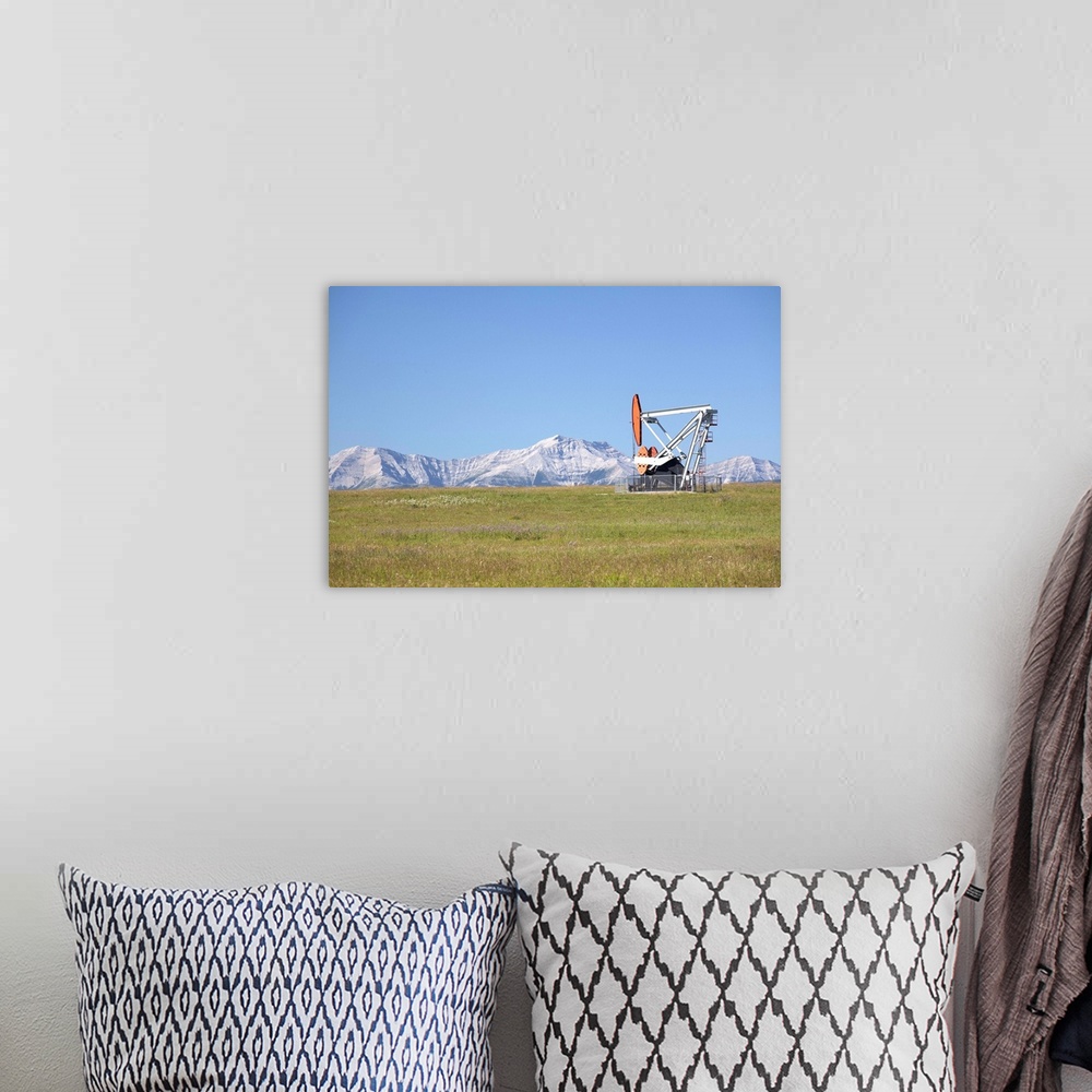 A bohemian room featuring Pumpjack With Mountains And Blue Sky In The Background