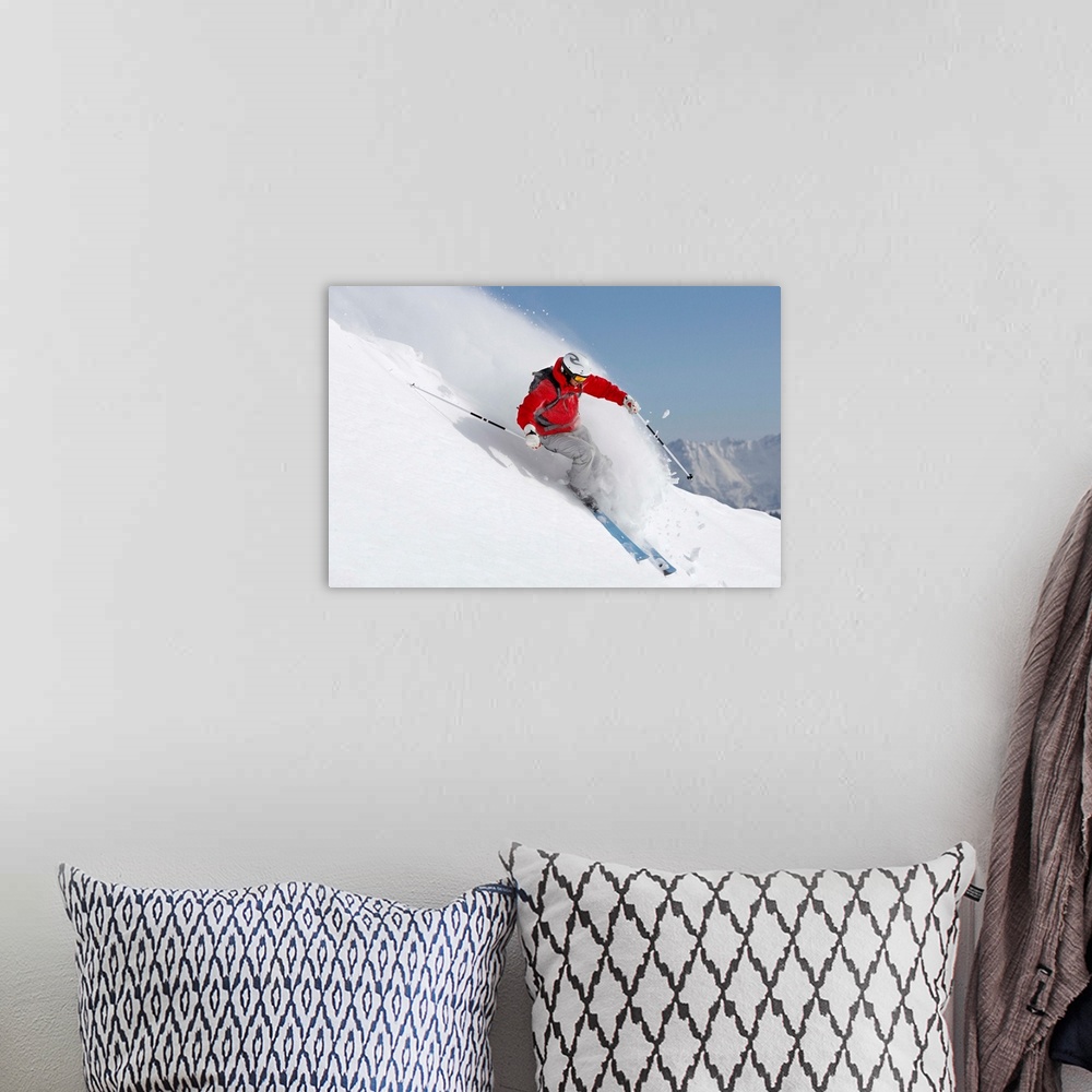 A bohemian room featuring Austria, Saalbach, male skier turning in snow on slope