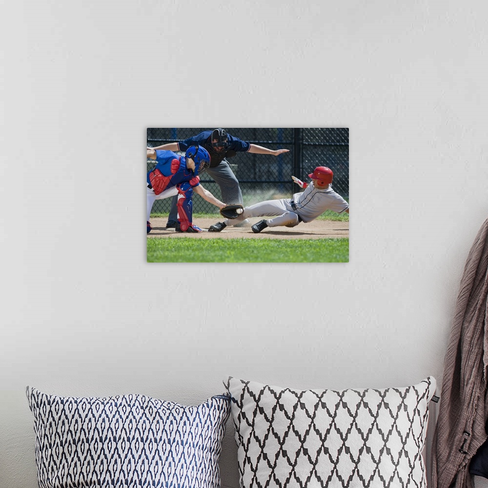 A bohemian room featuring Baseball player sliding into home plate