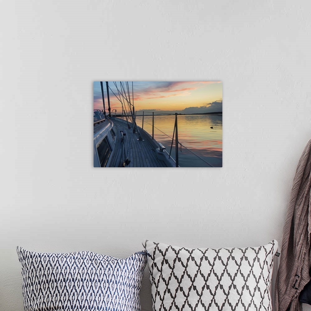 A bohemian room featuring Bow of 62 ft sailboat at sunset