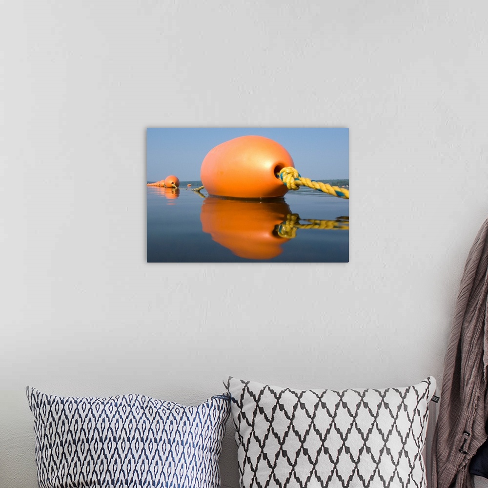 A bohemian room featuring Orange Buoy on a calm lake in the summer. Jefferson, Maine