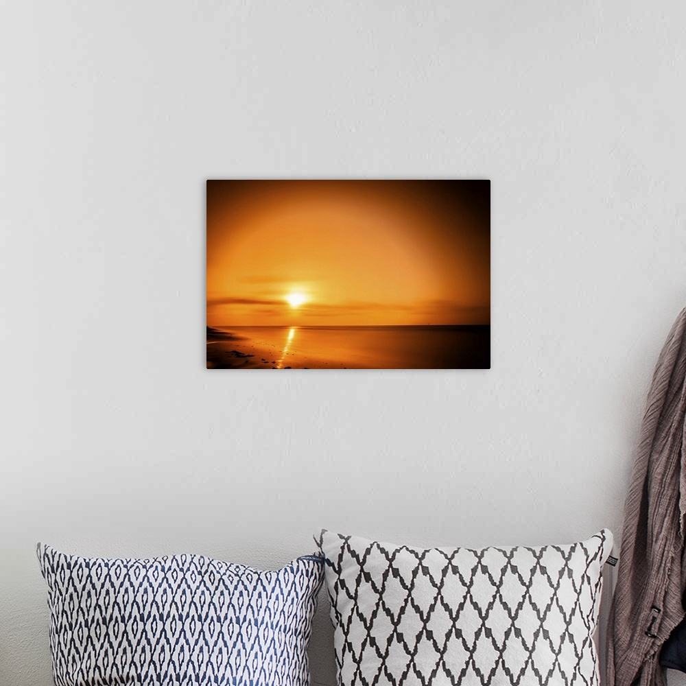 A bohemian room featuring The sun rises over The Gulf of Mexico in this waterscape. Taken in the Surfside Beach area, Brazo...