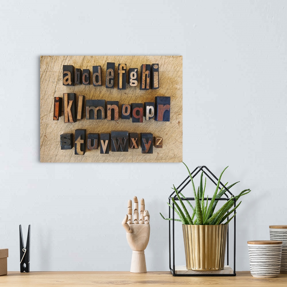 A bohemian room featuring Close up of alphabet on letterpress