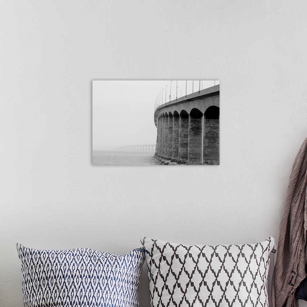 A bohemian room featuring Confederation bridge, Prince Edward Island and New Brunswick on a cloudy foggy day.