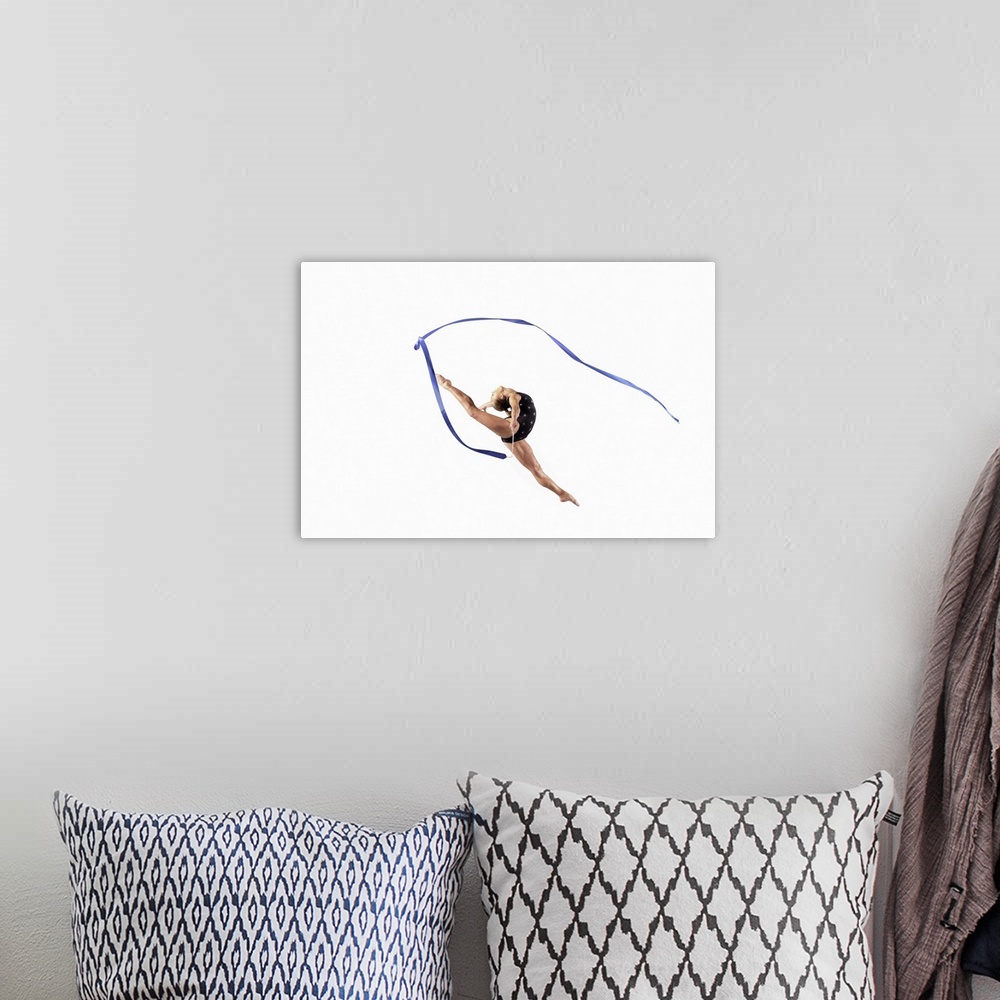 A bohemian room featuring Female Athlete Jumping Gracefully Mid Air With a Ribbon