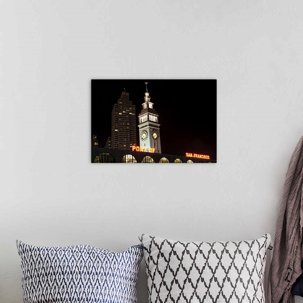 A bohemian room featuring Ferry Building at night with Port of San Francisco sign.