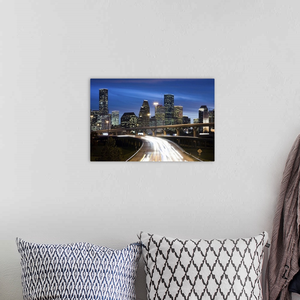 A bohemian room featuring Houston skyline at dusk with freeway in foreground