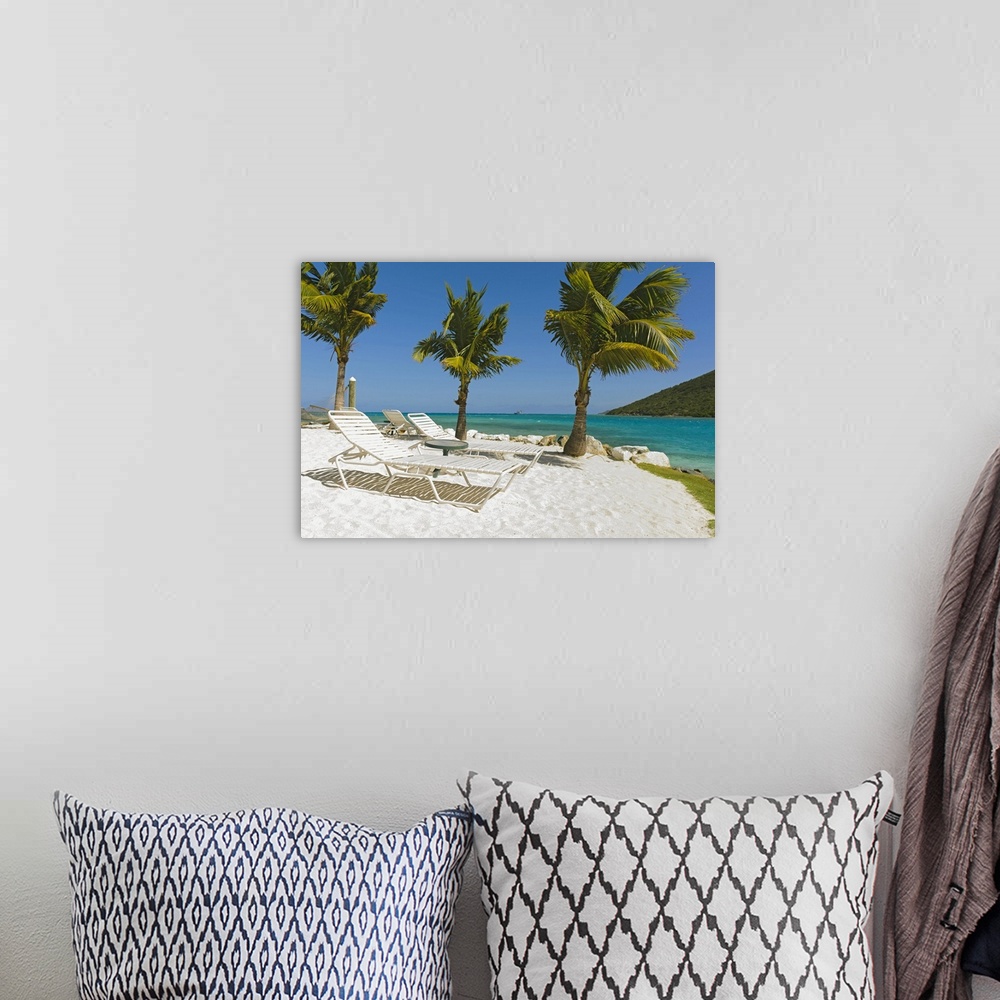 A bohemian room featuring Idyllic beach with empty lounge chair