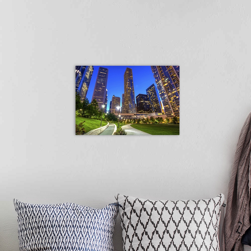 A bohemian room featuring Lakeshore East Park in Chicago looking toward the the Aon Center and Aqua buildings.