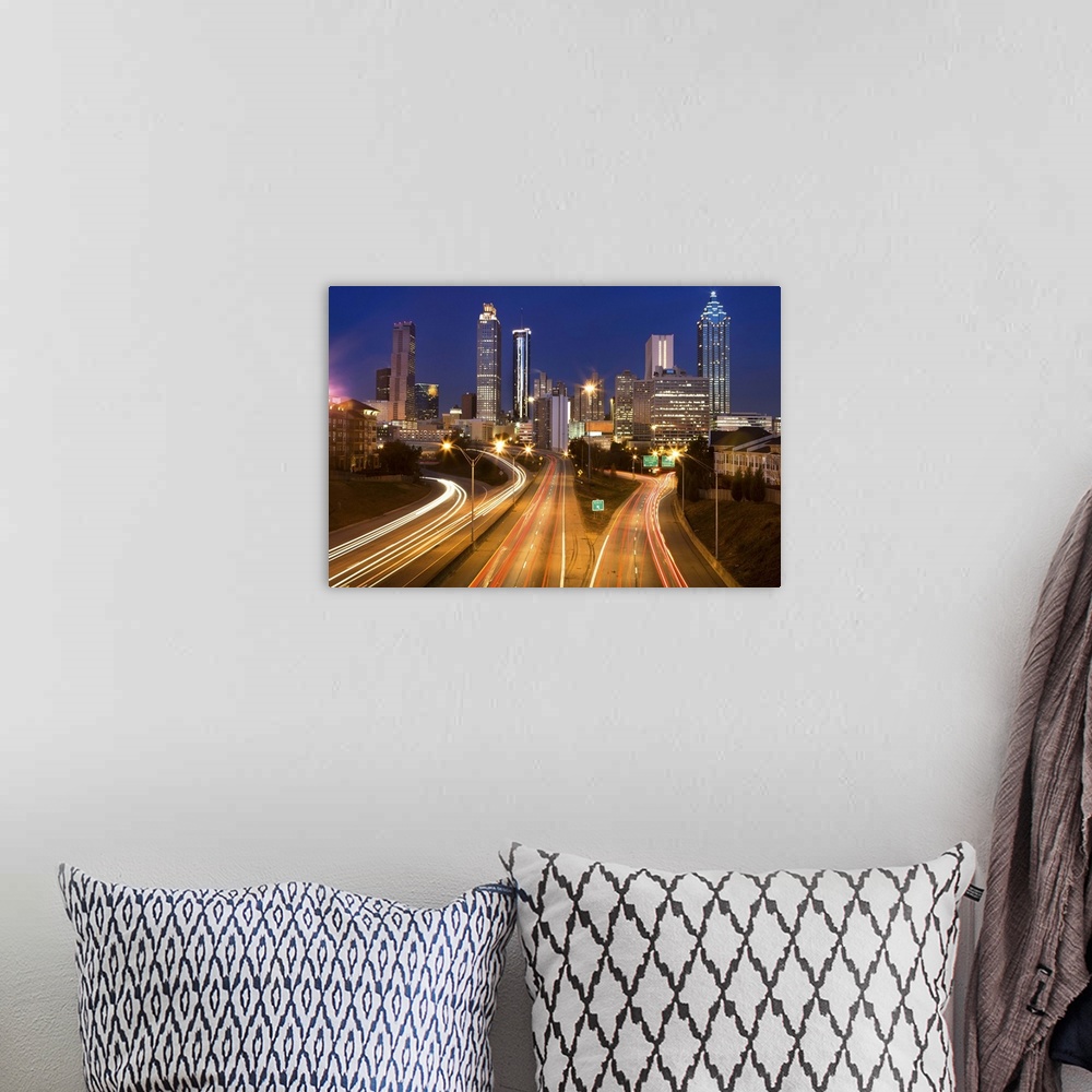 A bohemian room featuring Atlanta city office buildings and highway traffic motion blur