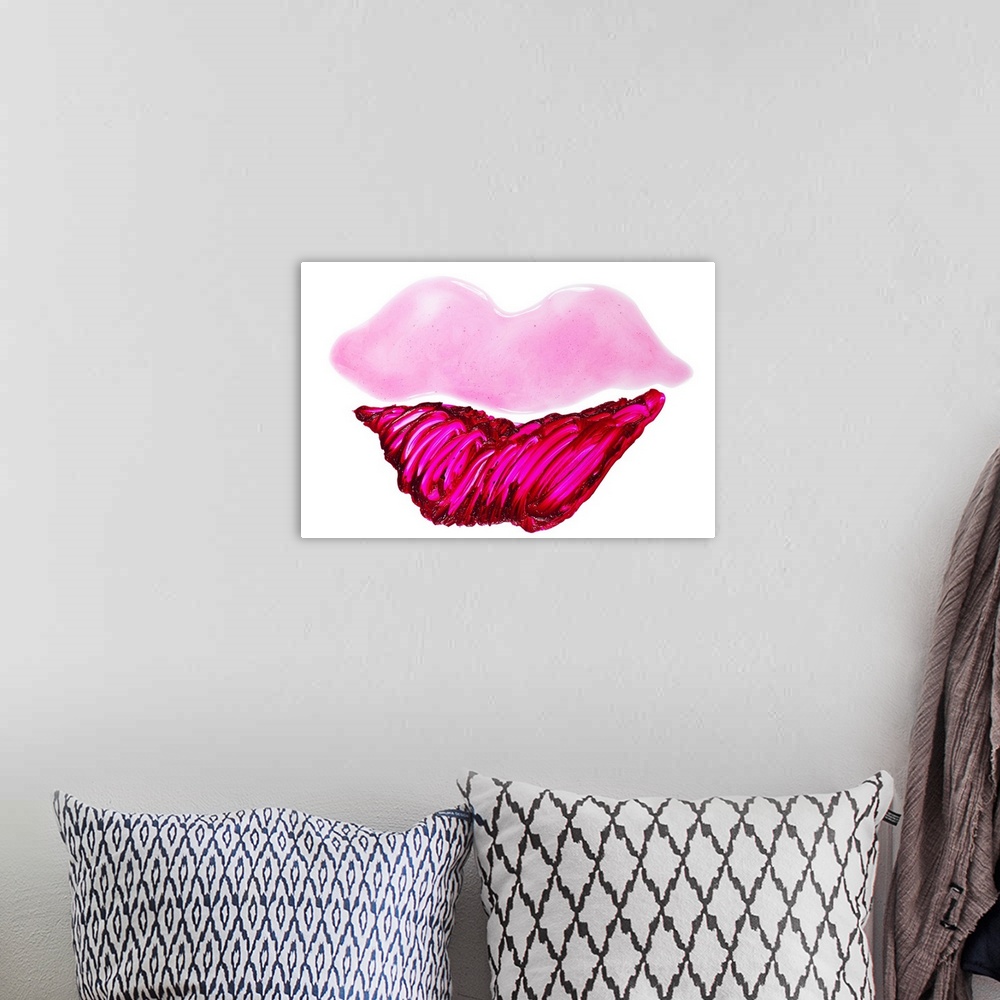 A bohemian room featuring Lip gloss and lipstick smeared into a lip shape on a white surface.