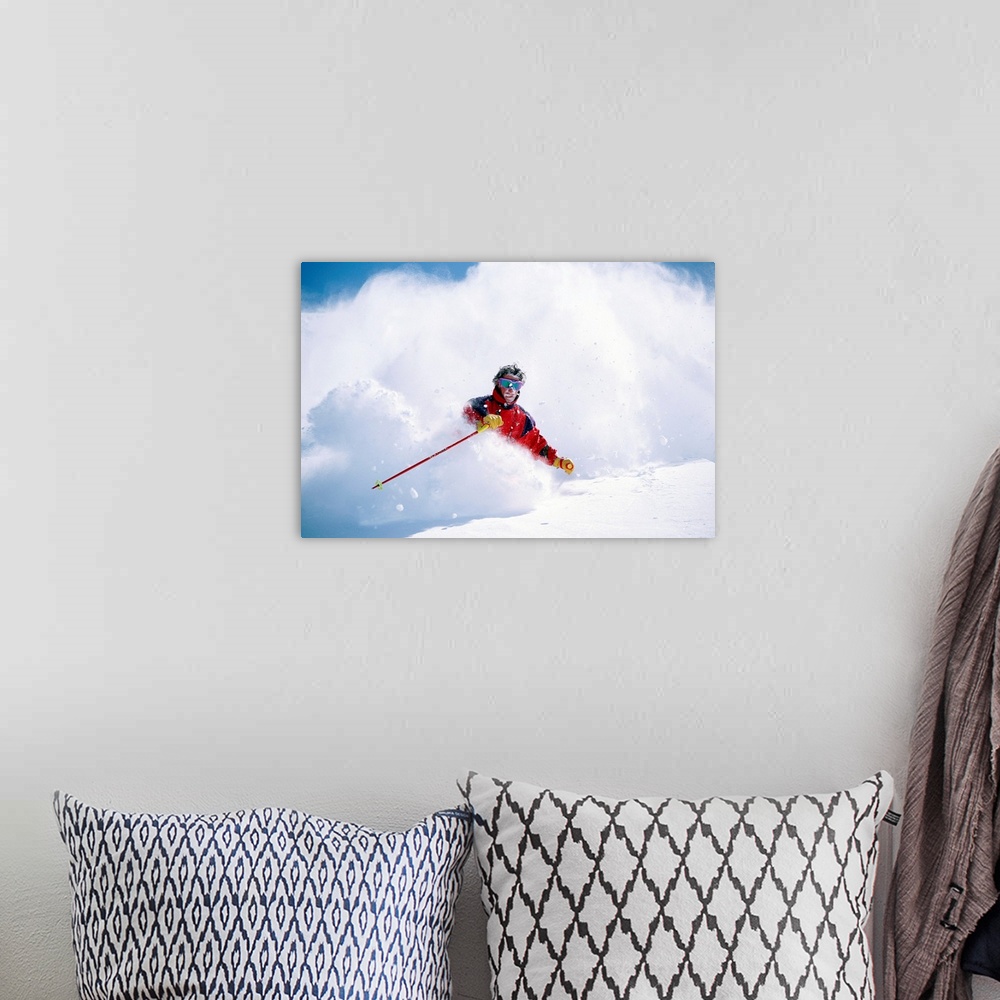 A bohemian room featuring Man downhill skiing in cloud of powdery snow