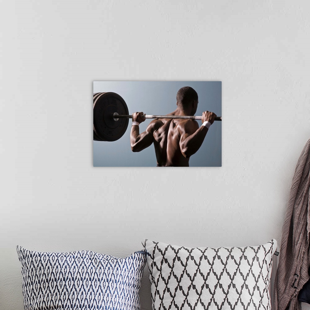 A bohemian room featuring African American man working out the gym