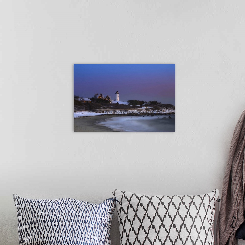A bohemian room featuring Nobksa lighthouse photographed after a fresh snowfall on Cape Cod.  Image was taken at dusk and t...