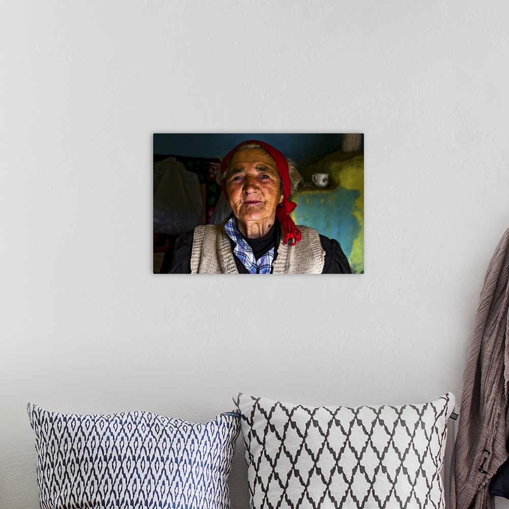 A bohemian room featuring Old woman in rustic house