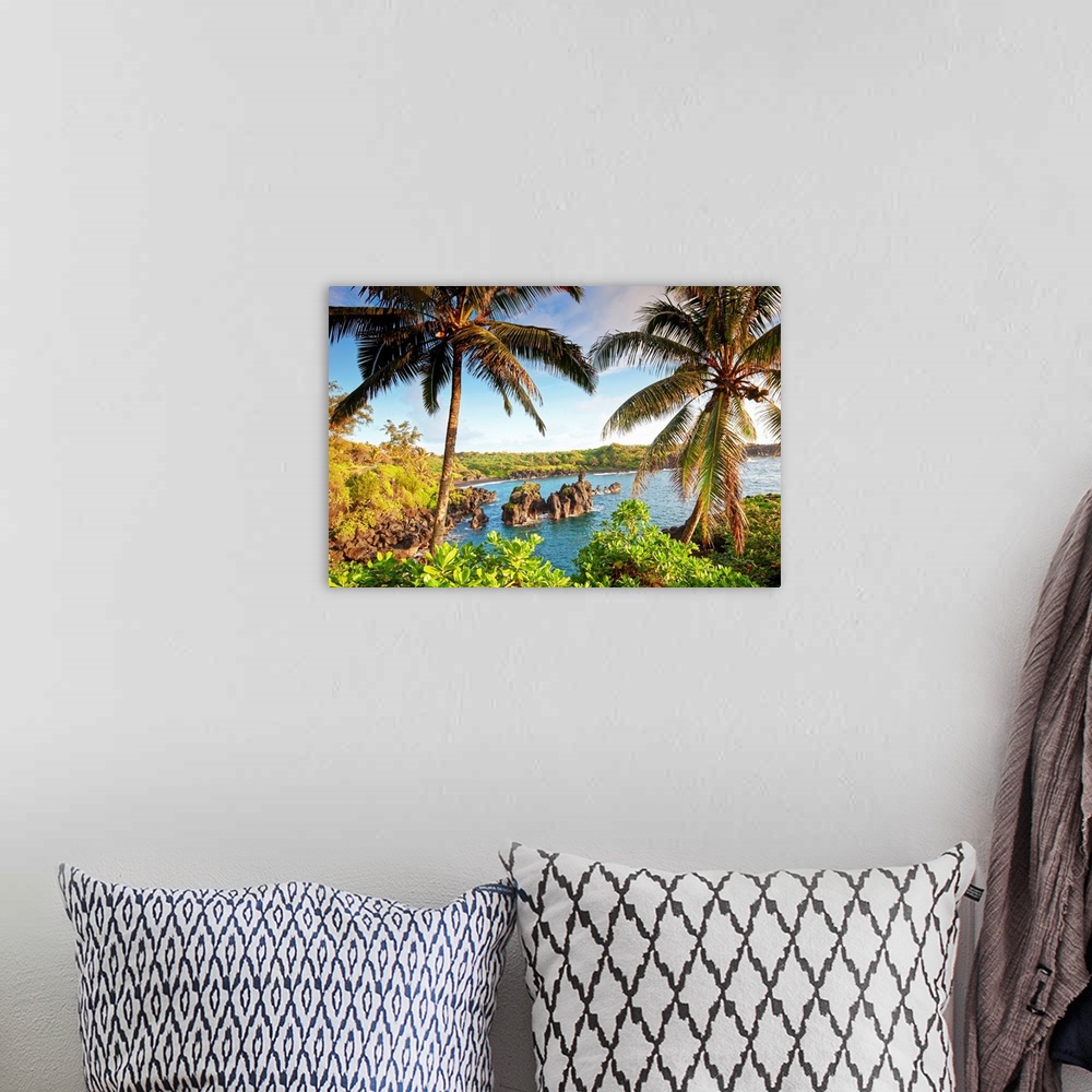 A bohemian room featuring Landscape photograph of two large palm trees swaying over the coastline in Maui, Hawaii.  Large r...