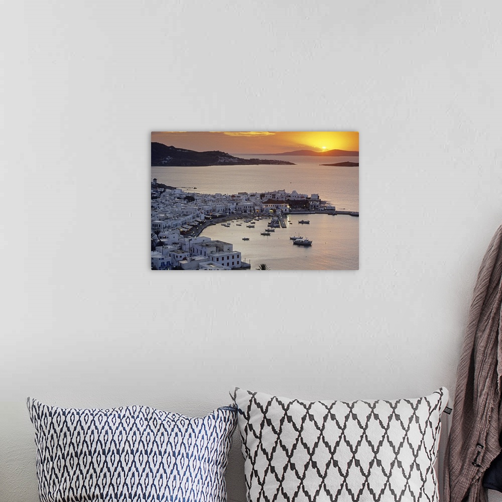 A bohemian room featuring Port of the island of Mykonos, one of the Cyclades islands in the Aegean sea at sunset.