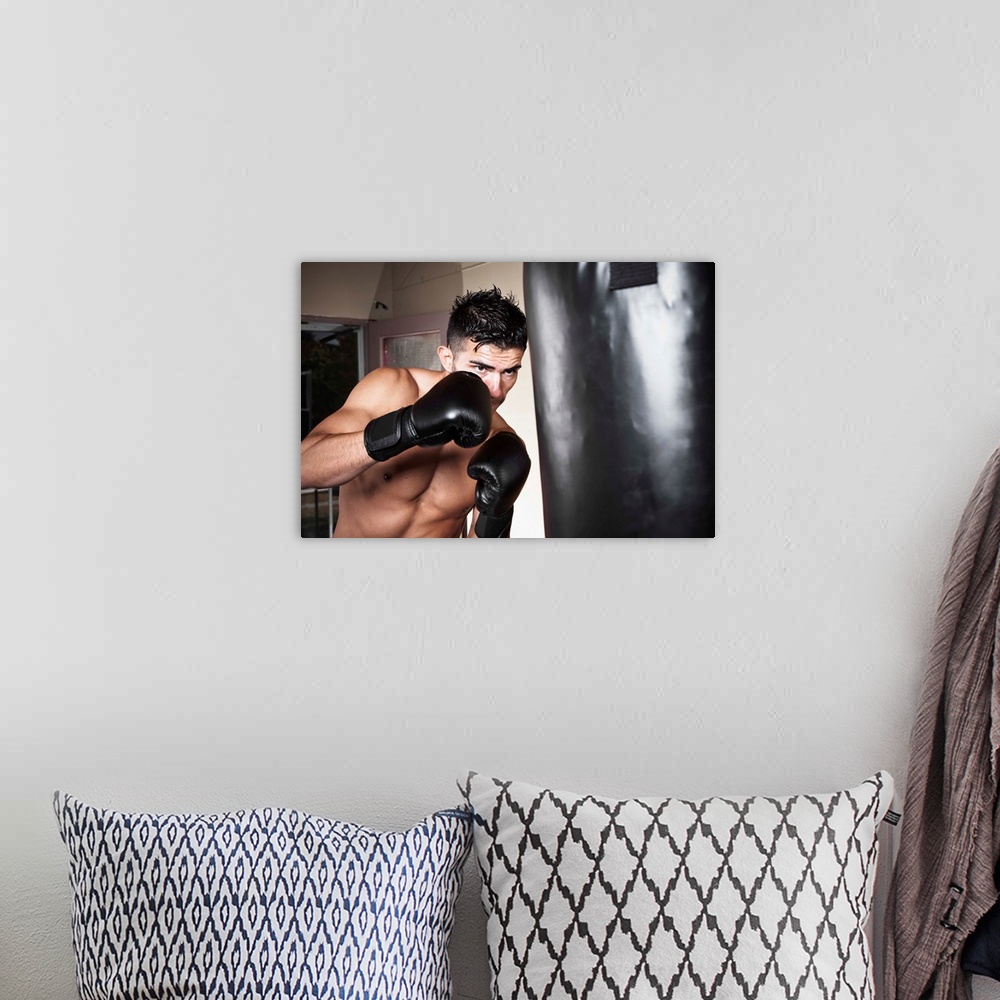 A bohemian room featuring USA, Seattle, Portrait of young man boxing in gym