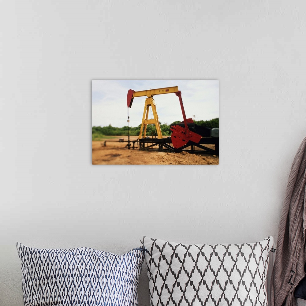 A bohemian room featuring After an oil well has been located and drilled the pump jack pumps the oil out of the ground.