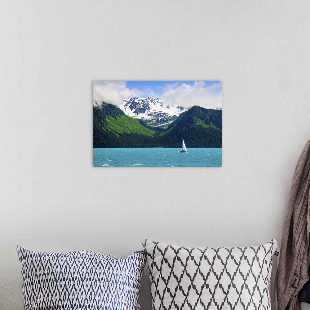 A bohemian room featuring Sailing ship in Resurrection bay with mountains in background, Seward, Alaska, USA.
