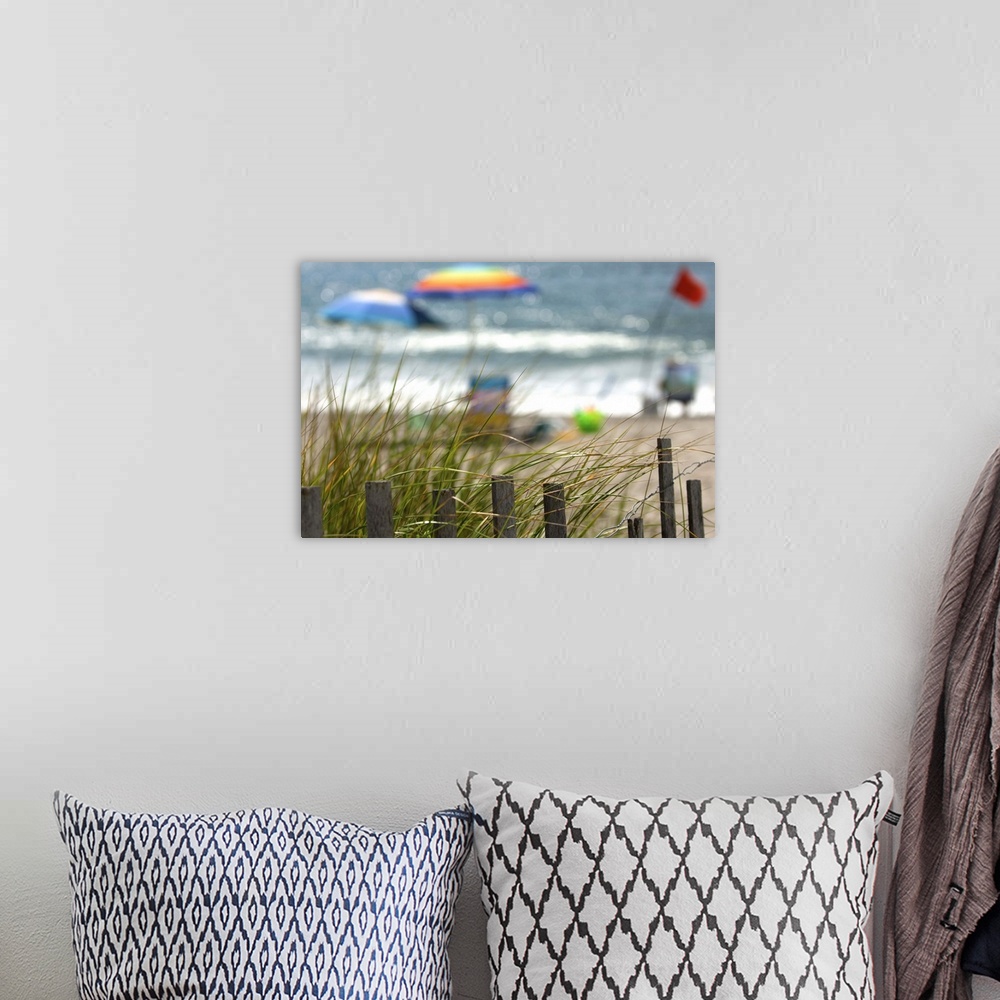 A bohemian room featuring Selective focus of tourists enjoying the beach
