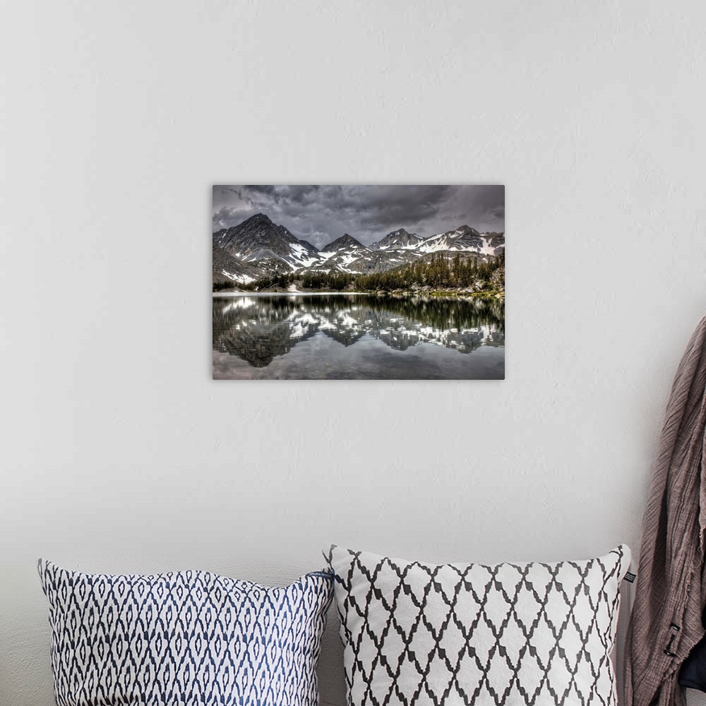 A bohemian room featuring Looming storm reflecting over High Sierra Lake