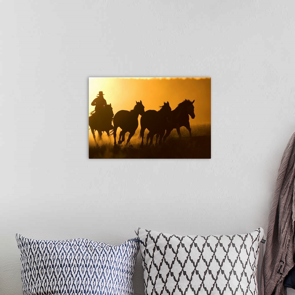 A bohemian room featuring Silhouette Of Cowboy Herding Horses