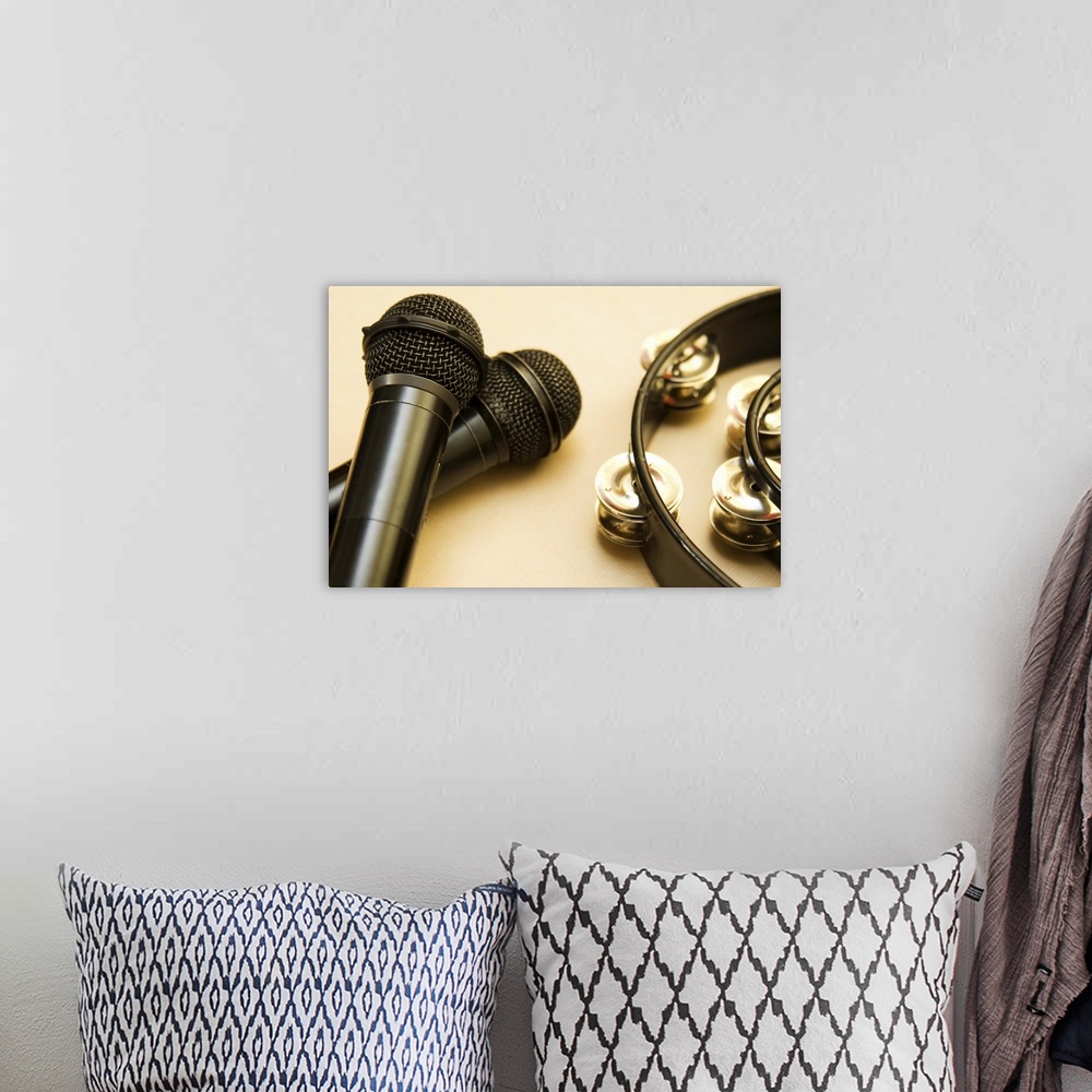 A bohemian room featuring Still Life image of tambourine and microphone