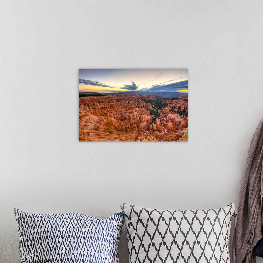 A bohemian room featuring A moody sunrise at Inspiration Point in Bryce Canyon National Park still manages to reveal the de...