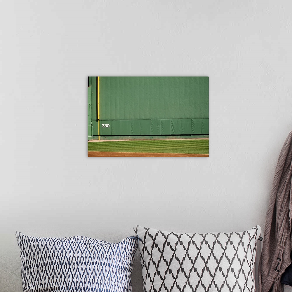 A bohemian room featuring This wall is known as 'the Green Monster.'Foul line and distance marker visible.