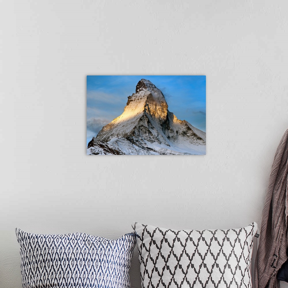 A bohemian room featuring The peak of the Matterhorn at sunrise.