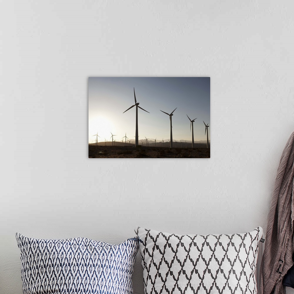 A bohemian room featuring Wind turbines in a desert landscape