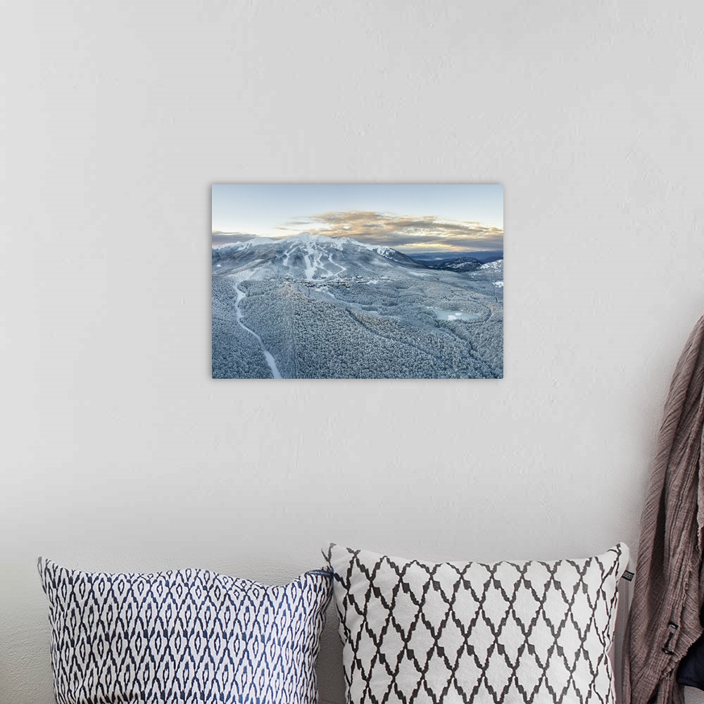 A bohemian room featuring Aerial view of Cerreto Laghi in winter time after a snowing, municipality of Ventasso, Reggio Emi...