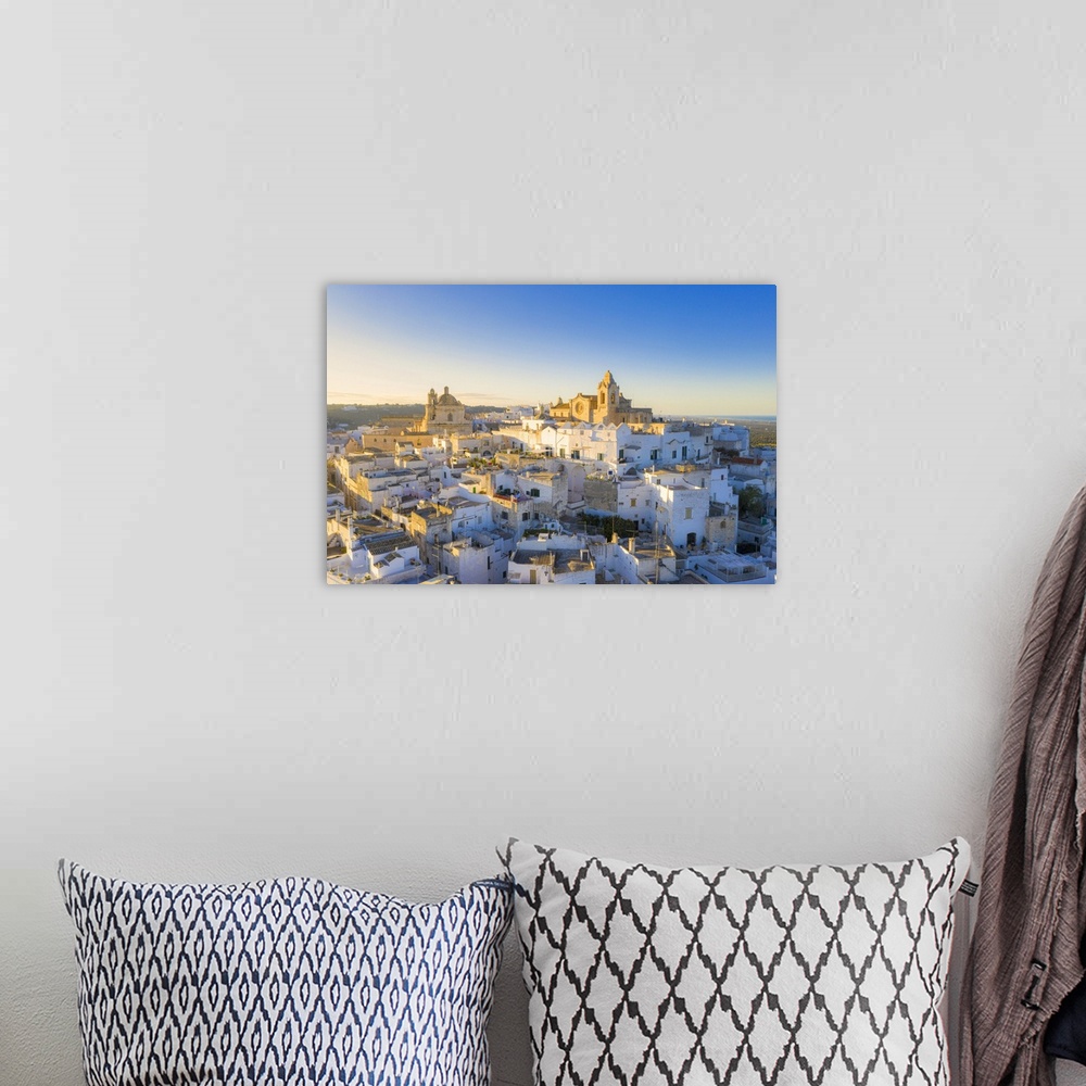 A bohemian room featuring Aerial view of the old town of Ostuni at sunset, Apulia, Italy