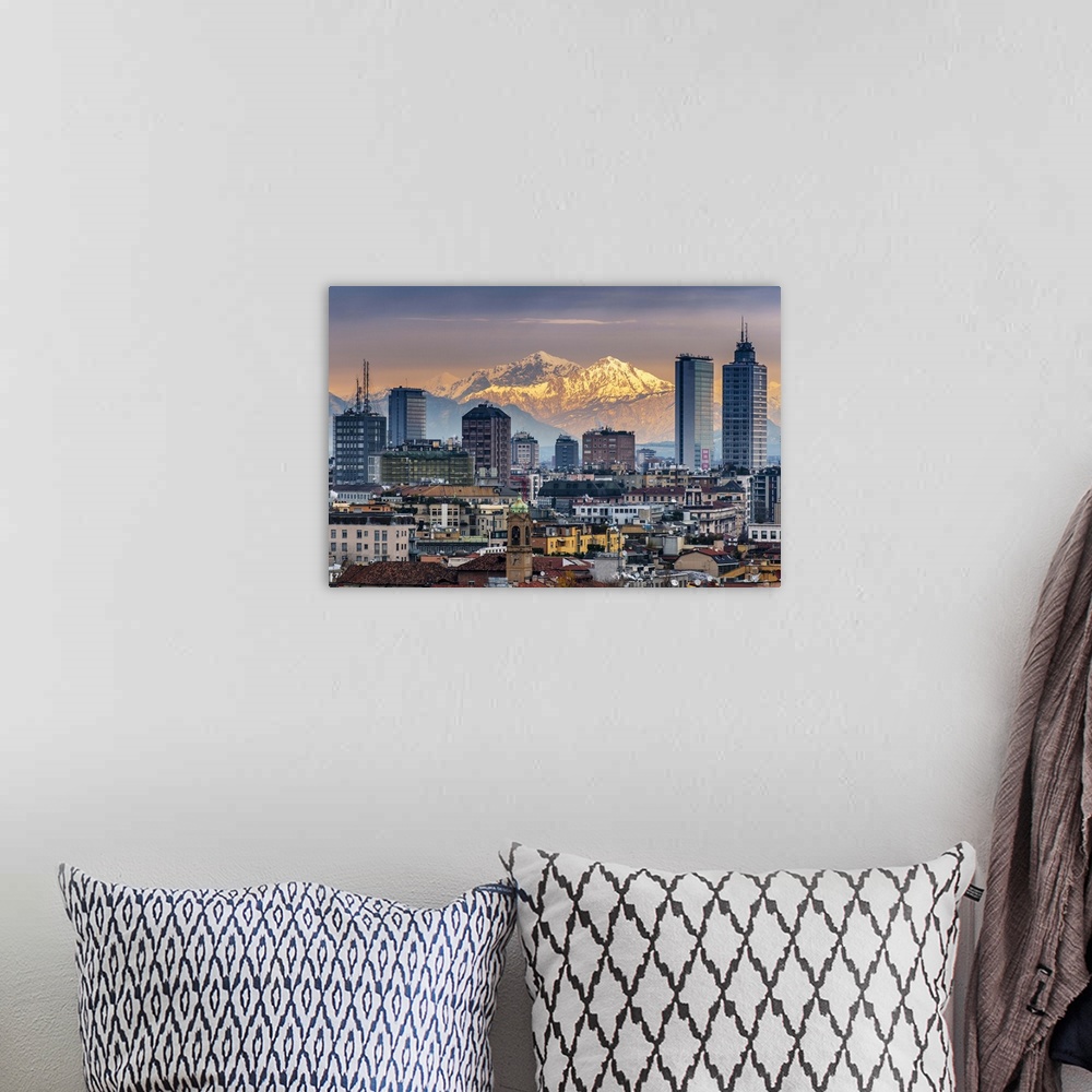 A bohemian room featuring City skyline at sunset with the snowy Alps in the background, Milan, Lombardy, Italy