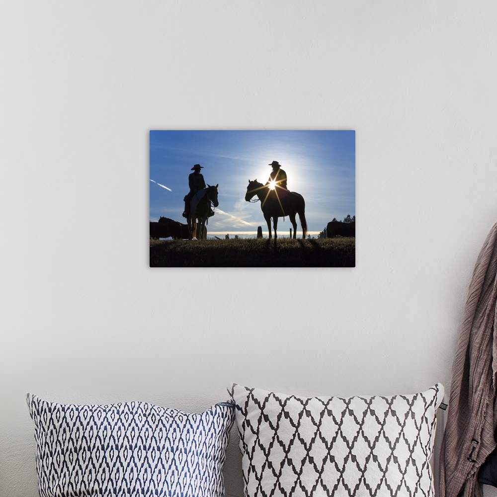 A bohemian room featuring Cowboys on horses, sunrise, British Colombia, Canada.