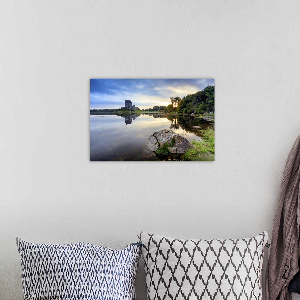A bohemian room featuring Europe, Dublin, Ireland, Dunguaire castle in Kinvara village at sunrise reflecting in the ocean
