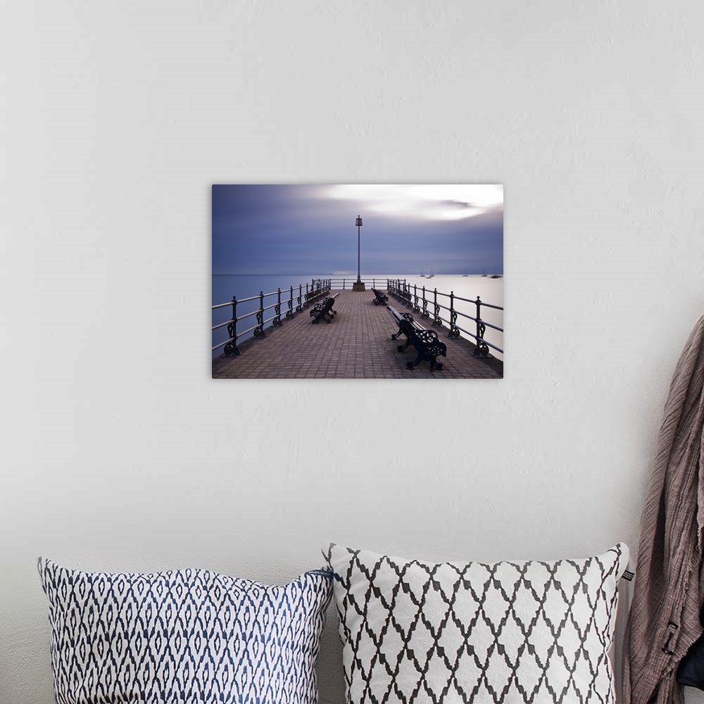 A bohemian room featuring England, Dorset, Swanage. Sunrise from the Banjo Jetty at Swanage, with the Isle of Wight just vi...
