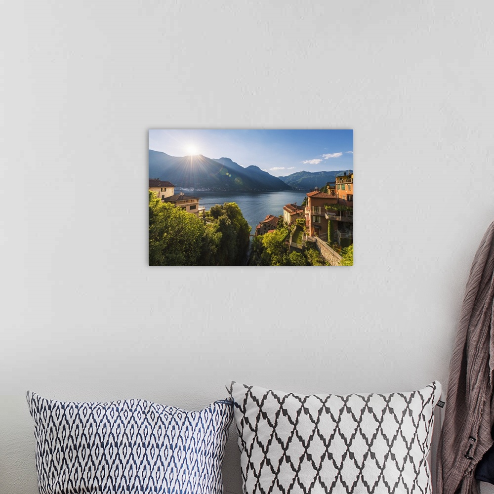 A bohemian room featuring Nesso, lake Como, Como province, Italy, Europe. High angle view over the roman stone bridge and t...