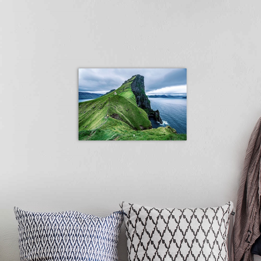 A bohemian room featuring Hiker near the Kalsoy Lighthouse, Faroe Islands, Europe.