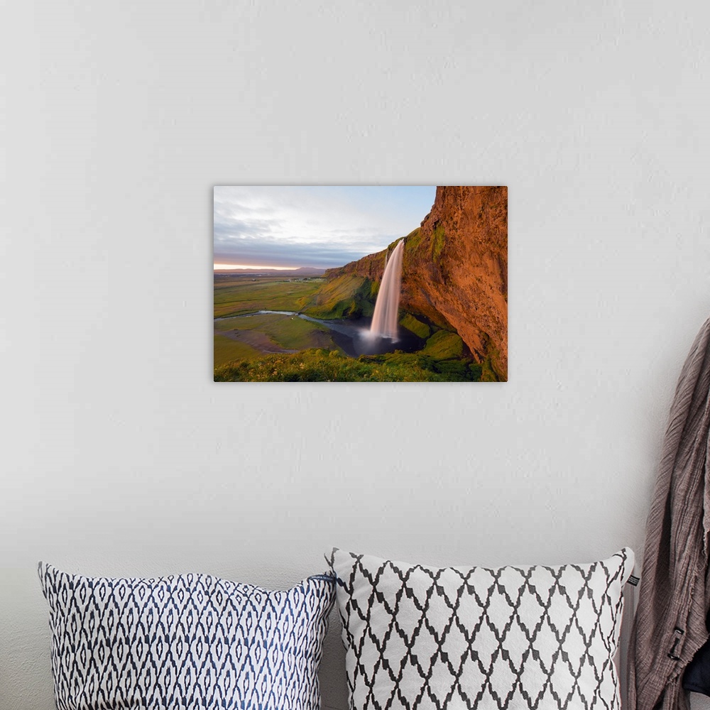 A bohemian room featuring Iceland, southern region, Seljalandsfoss waterfall, sunset.
